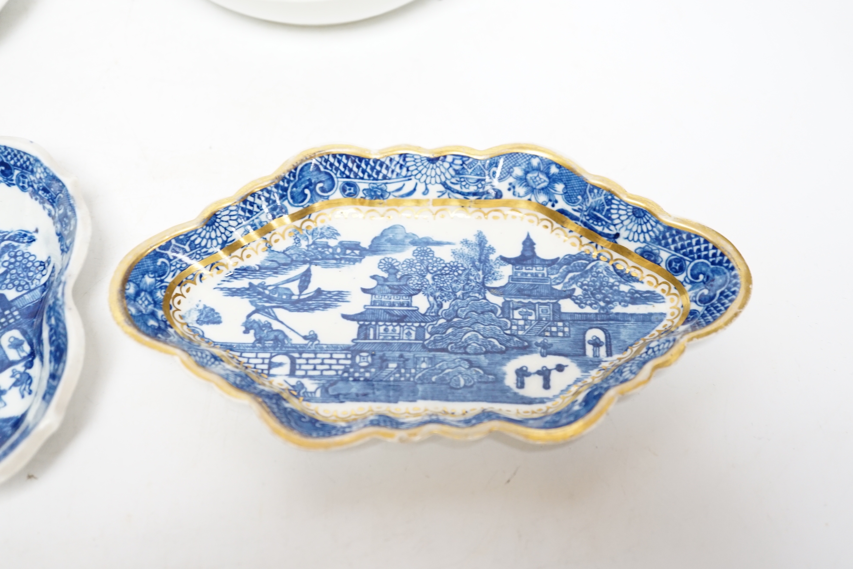 A group of Caughley pagoda pattern table wares, late 18th century, including two teapot stands, a coffee cup and saucer and a spoon tray